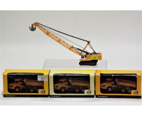 Four Diecast construction vehicles, three Volvo boxed, scale 1:87 