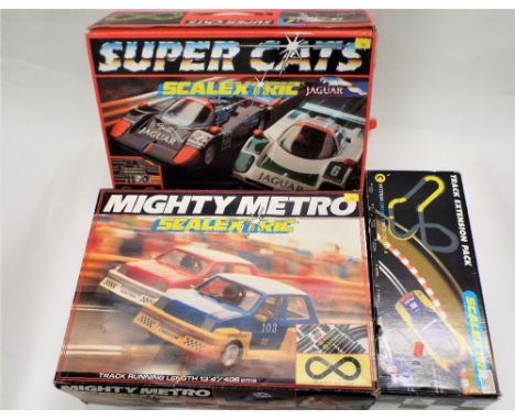 Scalextric Mighty Metro set and Super Cats set and track extension pack