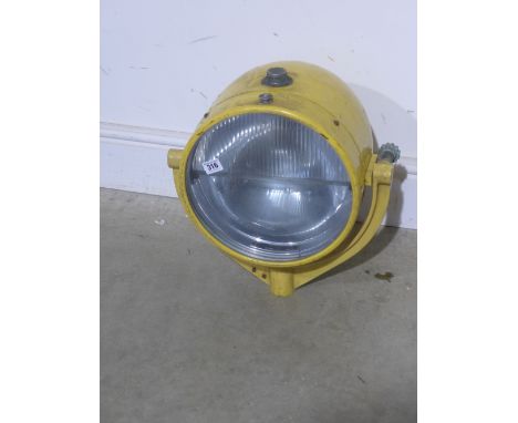 A large yellow painted aluminium landing light by Harley - mounted on a U shape Gimble bracket - Diameter 30 cm - Total heigh