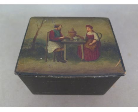 A Russian lacquered papier mache tea caddy - the top painted with a couple at tea, a Samovar set on the table 