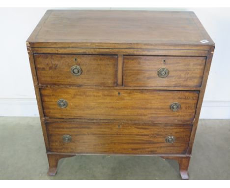A Regency ebony line inlaid mahogany chest - the caddy top above an arrangement of two short and three long drawers, standing