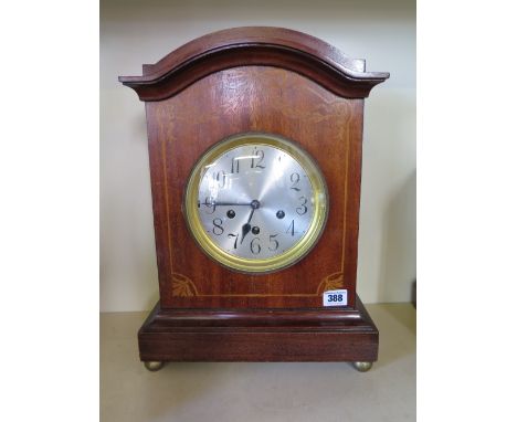 A Junghams three train chiming mahogany cased mantel clock with silvered dial - Height 43 cm x Width 31 cm 