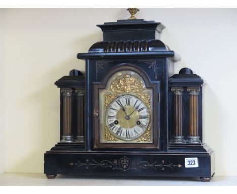 An ebonised case fourteen day mantel clock with brass dial by H.A.C. - strikes on gong
Condition report: Working