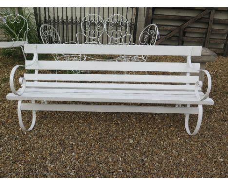 A white painted vintage garden bench 