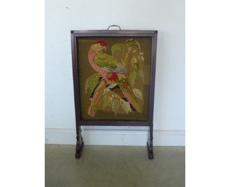 A Victorian mahogany and tapestry fire screen