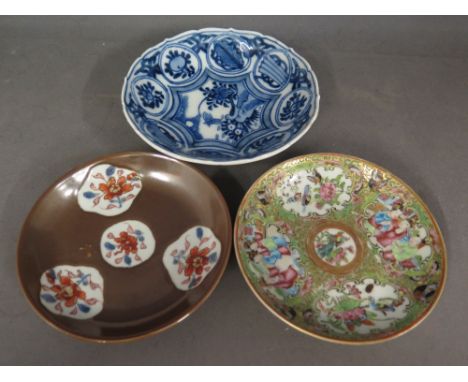 Three Oriental hand painted saucers 