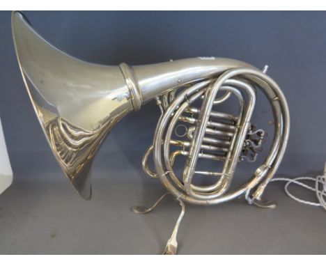 A vintage French horn cleverly converted to a table lamp