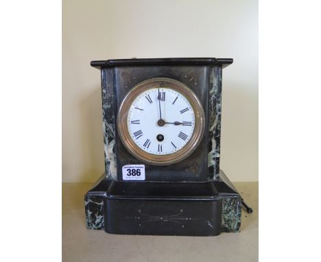 A black marble mantel clock - Height 23 cm x Width 21 cm 