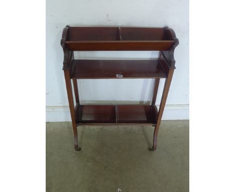 An Edwardian line inlaid mahogany bookstand - the trough top supported on square section uprights and splayed feet - Width 54