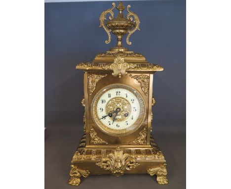 A 19th century French brass cased - Japy Freres - mantel clock - the case extensively decorated with cast and applied decorat