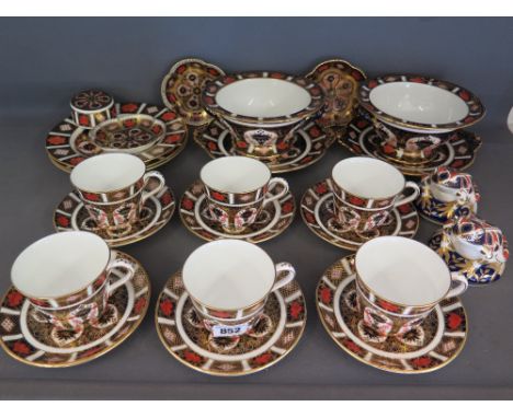 A collection of Crown Derby Bone China Old Imari tableware to include six cups and saucers, three 8 1/4" plates, two tureens 