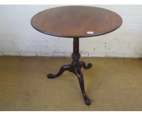 A 19th century tripod table on a turned wrythern base - top diameter 65 cm 