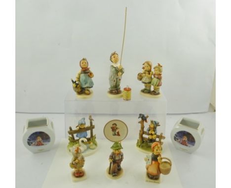 A QUANTITY OF GOEBEL HUMMEL FIGURINES, including "Parade of Lights", "Feathered Friends", "Mischief Maker", "Visiting an Inva