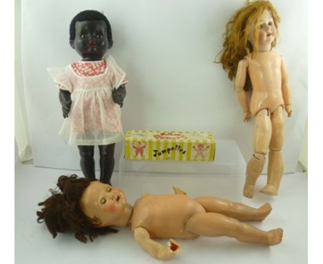 A MID 20TH CENTURY BLACK DOLL, with articulated limbs together with a BISQUE HEADED DOLL, one other doll and a boxed PELHAM P