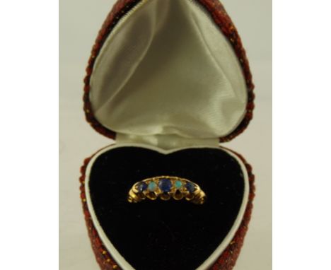 E.E. THOMPSON & SONS LTD. AN EDWARDIAN 18CT GOLD SAPPHIRE AND OPAL HALF HOOP RING having three sapphires and two opals in a f