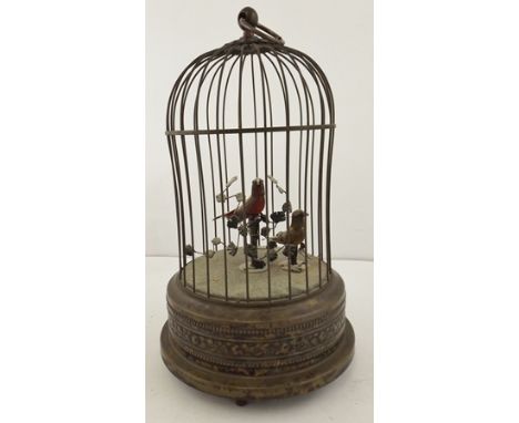 AN EARLY 20TH CENTURY CLOCKWORK AUTOMATON OF TWO SINGING BIRDS IN A BRASS CAGE, probably French, each bird with articulated h