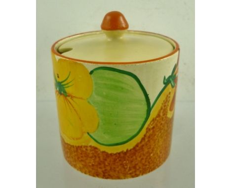 CLARICE CLIFF A BIZARRE "NASTURTIUM" PATTERNED PAINTED CYLINDRICAL PRESERVE JAR, circa 1930, having factory back stamp, 7.5cm