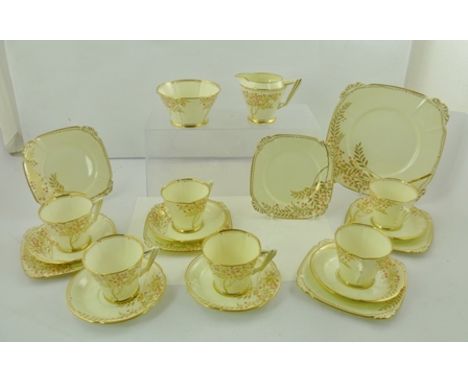 A ROYAL ALBERT PART TEA SET of Art Deco design, having hand coloured and gilded blossom, comprising serving dish, 6 x tea pla