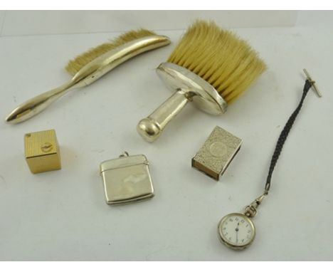 TWO SILVER CRUMB BRUSHES, a plain silver VESTA CASE, an engraved silver MATCH SLIDE, an early 20th Century Swiss Lady's silve