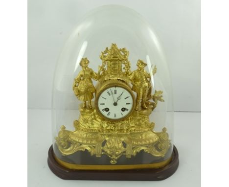 A LATE 19TH CENTURY GILDED SPELTER MANTEL CLOCK, decoratively cast with 18th century peasant figures, white enamel dial with 