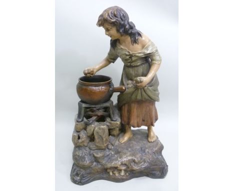 A EUROPEAN STONEWARE LAMP modelled as a young peasant or gypsy girl boiling potatoes in a cauldron over an open fire, polychr