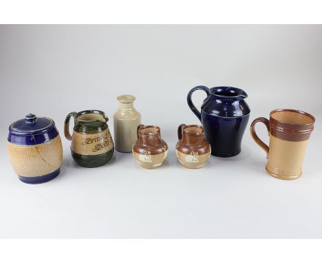 A collection of Doulton Lambeth and Royal Doulton tableware and a tobacco jar, to include a pair of jugs decorated with count