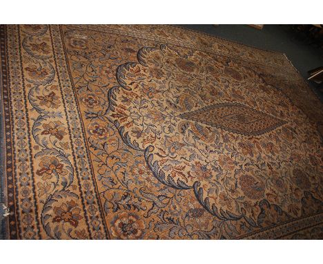 A large wool carpet with birds and scrolling floral design, in blue and orange on beige ground (a/f), 295cm by 403cm