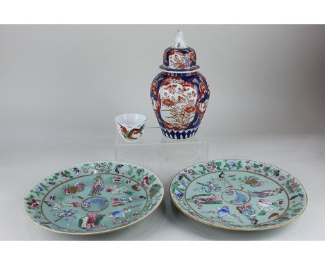 Two similar Chinese porcelain plates decorated with figures, flora and fauna, on celadon ground, both with character marks to