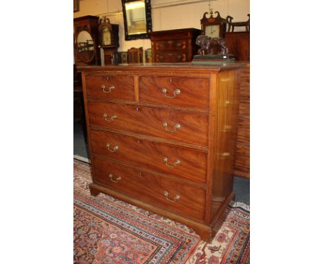 A mahogany chest of two short over three long drawers with brass swan neck drop handles, on bracket base, 107cm