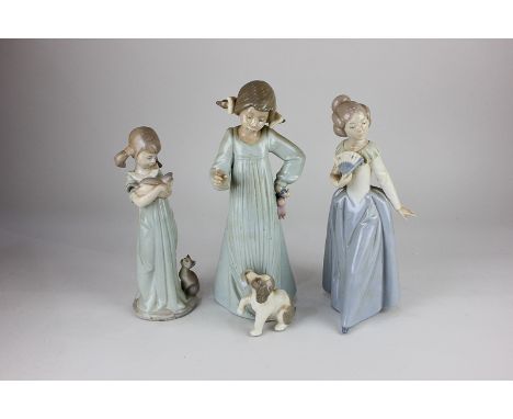 A Lladro porcelain figure of a girl with kittens, two Nao porcelain figures, a lady with fan, and a girl with puppy, tallest 