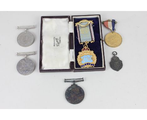 A George V Faithful Service Special Constabulary medal, two Second World War medals, a Masonic gilt and enamel medal, a silve