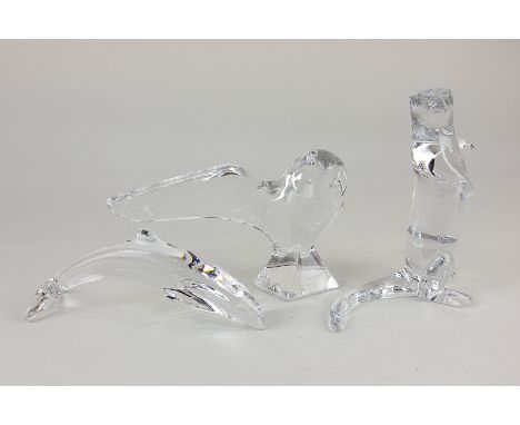 Three Baccarat clear glass models of animals comprising an owl marked R Rigot, 10.5cm, an otter, 14cm, and a dolphin, 6.5cm