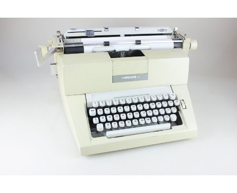 A Hermes 9 cream coloured typewriter, 38cm