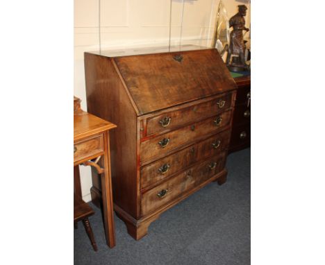 A George III mahogany bureau with fall enclosing fitted interior above four drawers, on bracket feet (a/f), 96cm