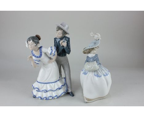 A Nao figure group of a couple in flamenco costume, 28cm, and another of a lady, 25cm