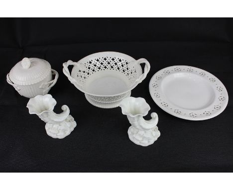 Three pieces of Leeds Creamware pottery including a lidded sugar bowl with flower finial, a reticulated dish with twisted han