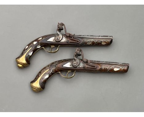 Two Antique Ottoman silver &amp; mother pf pearl flintlock pistols 19th century approx length 30cm