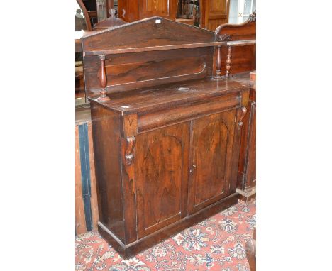 A Victorian rosewood chiffonier, architectural pediment, single shelf, turned columns, projecting base over single drawer and