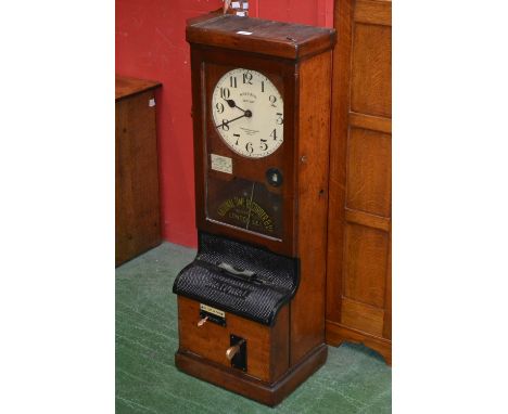 A clocking in machine National Electric, time recorder Co Ltd, London SE1 97.5cm high, 35cm wide, early 20th century