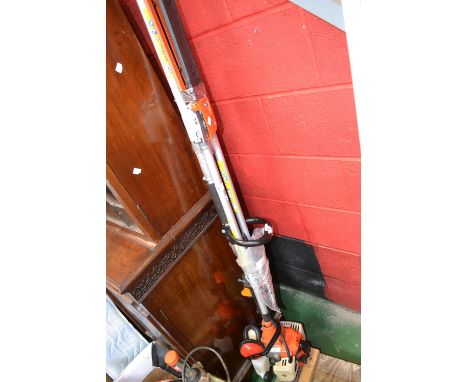 A Nordstrom Q2 petrol pole saw with hedge trimmer and chainsaw attachment.