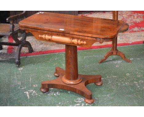 A rosewood card table, rounded fold over top enclosing green baize playing surface, canon barrel column, circular moulded soc