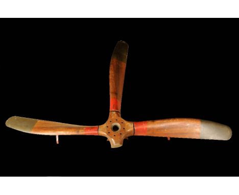 A First World War laminated aeroplane propeller boss and three blades. The boss marked 275 H.P. Rolls.Royce; right-hand 5156;