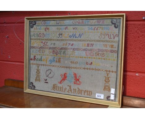 A 19th century alphabet sampler, Lillie Andrew, in colours above a lion and unicorn crest, 37cm x 50cm, framed and glazed 