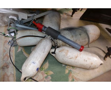 A 4kg boat anchor with rope and chain; another anchor; four boat fenders; a manual bilge pump