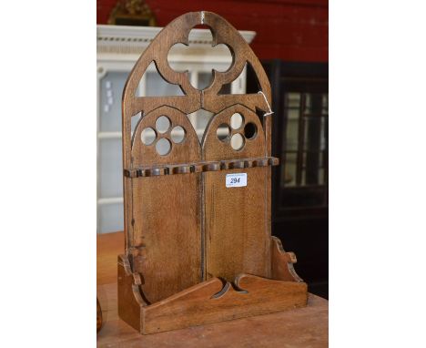 A mid 20th century Gothic revival pipe rack.