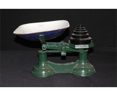 Green painted kitchen scales, with enamel pan and graduated weights