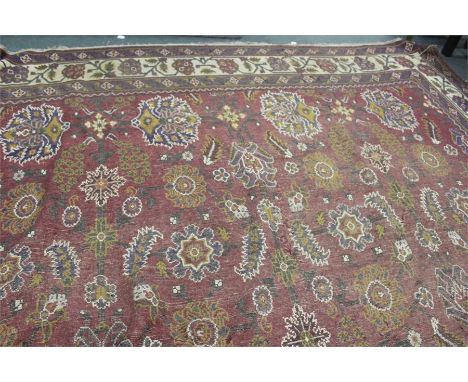 Large Middle Eastern carpet, the red ground with foliate decoration, 355cm wide