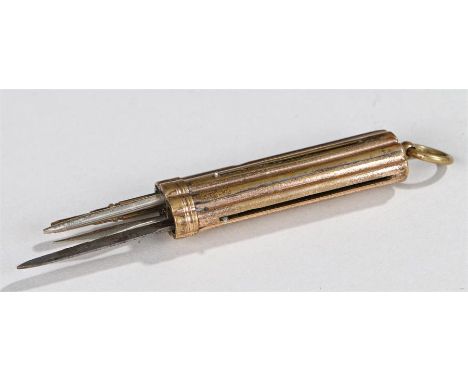 Gilt metal tool set, of flattened quatrefoil form with ring finial, containing knife, pencil, cigar piercer and metal rod