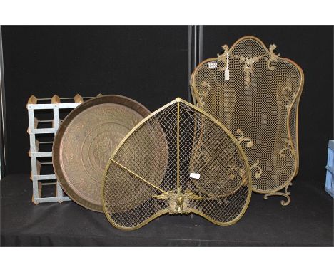 Brass fire screen with an eagle to the base, together with a Middle Eastern brass tray and another screen, also together with