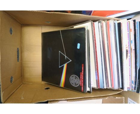 A box full of LP records including Pink Floyd - Dark Side of the Moon Re-issue, Wings, Blur, Status Quo + box set, Michael Ja